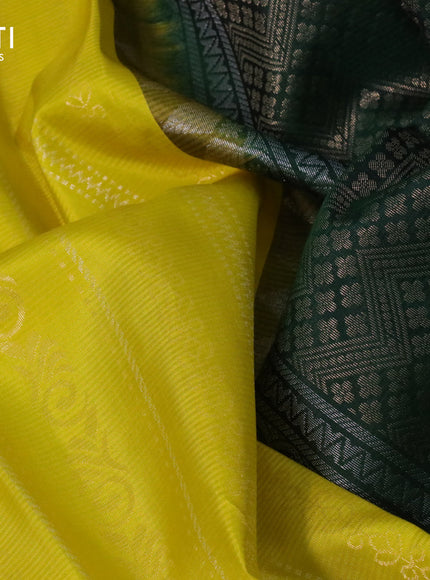 Pure soft silk saree yellow and green with allover zari weaves and silver zari woven border