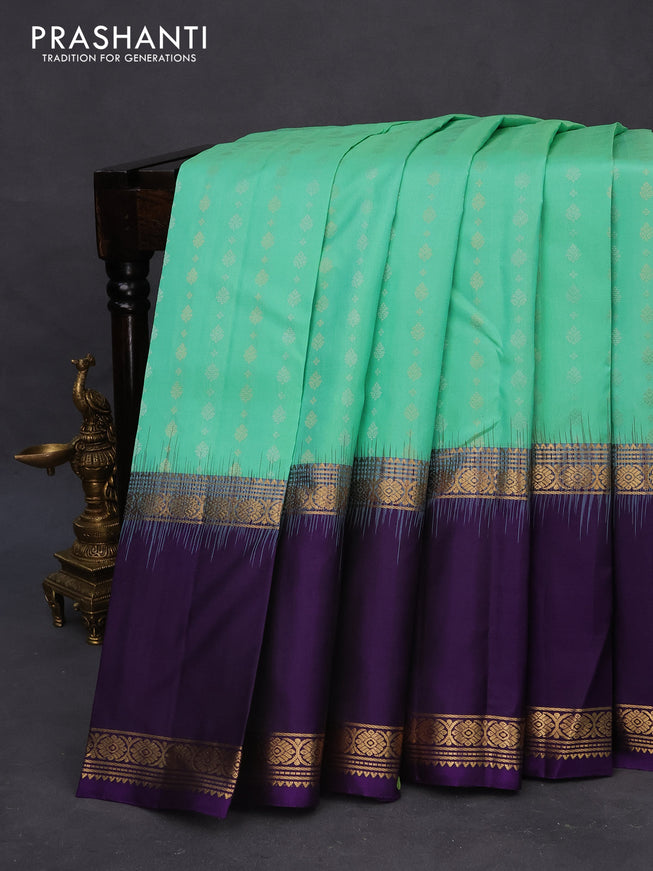 Pure soft silk saree teal green shade and violet with allover silver & gold zari woven butta weaves and long rettapet zari woven border