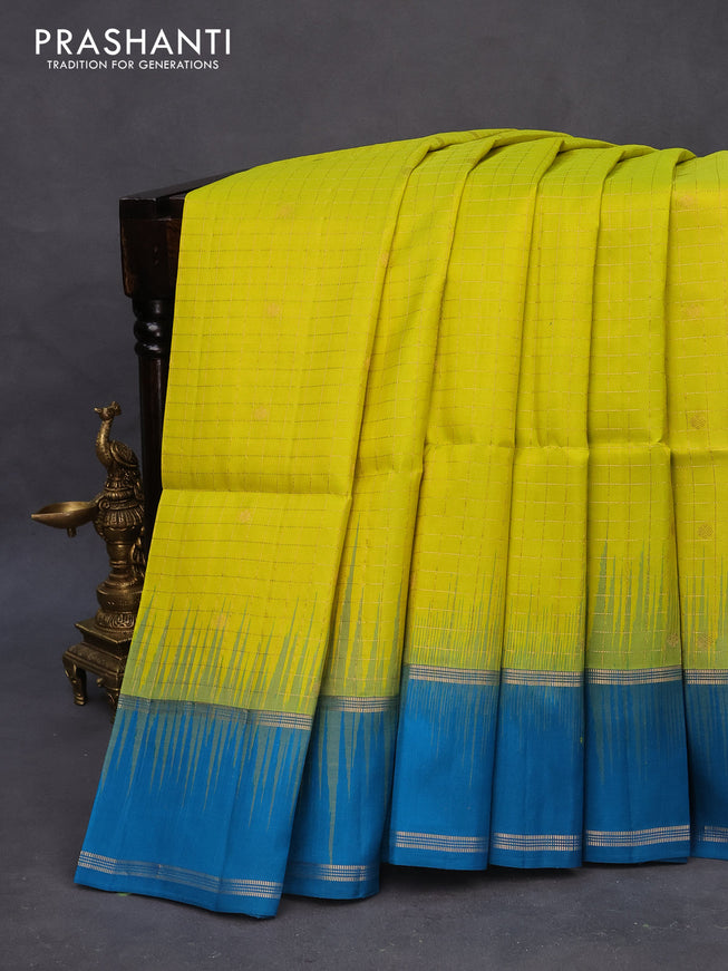 Pure soft silk saree yellow and cs blue with allover zari checks & buttas and rettapet zari woven border