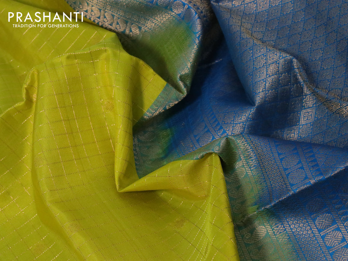 Pure soft silk saree yellow and cs blue with allover zari checks & buttas and rettapet zari woven border