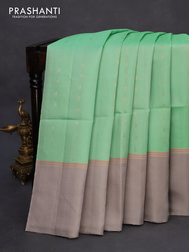 Pure soft silk saree pastel green and grey with allover zari woven buttas and zari woven simple border