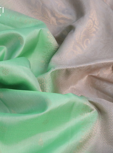 Pure soft silk saree pastel green and grey with allover zari woven buttas and zari woven simple border