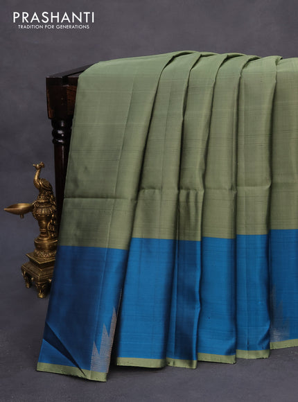 Pure soft silk saree green shade and cs blue with plain body and temple design zari woven border