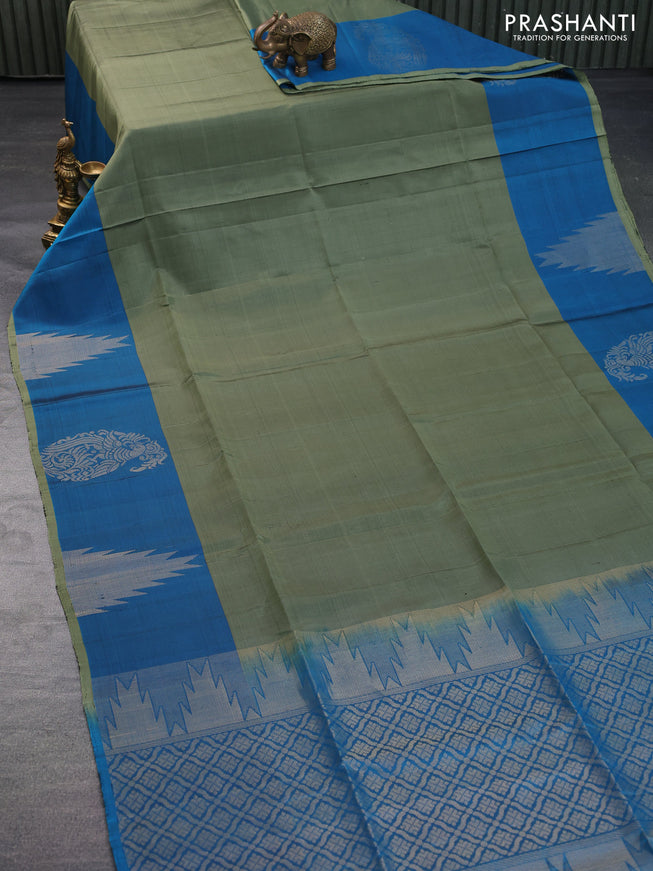 Pure soft silk saree green shade and cs blue with plain body and temple design zari woven border