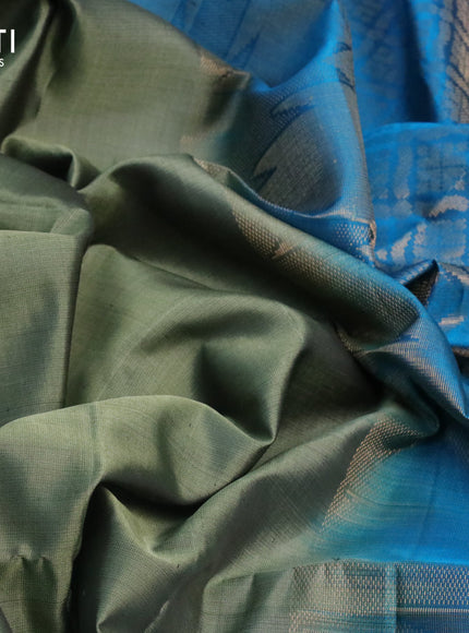 Pure soft silk saree green shade and cs blue with plain body and temple design zari woven border