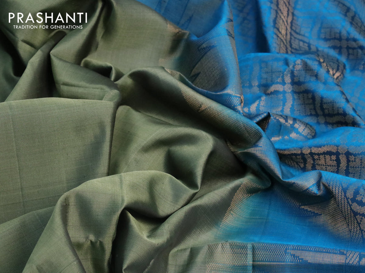 Pure soft silk saree green shade and cs blue with plain body and temple design zari woven border