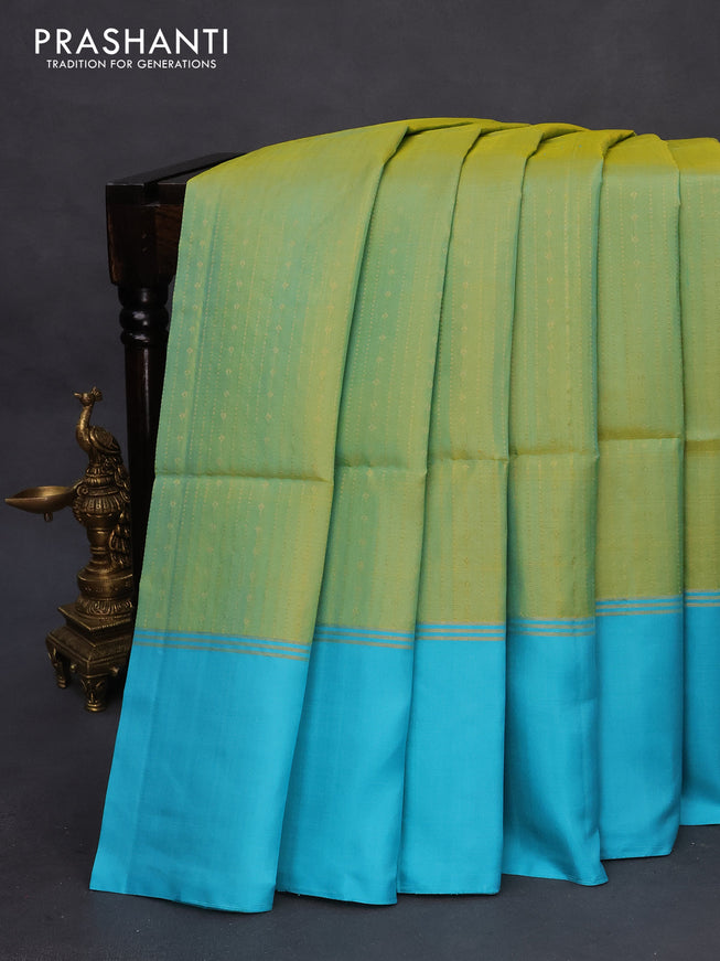 Pure soft silk saree green shade and light blue with allover zari weaves and zari woven simple border