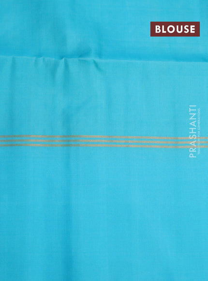 Pure soft silk saree green shade and light blue with allover zari weaves and zari woven simple border