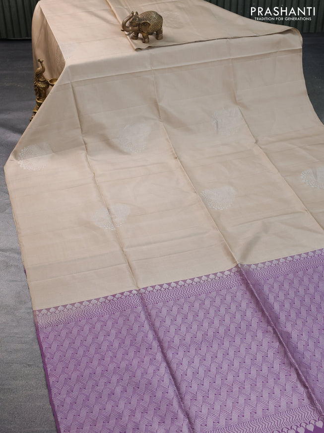 Pure soft silk saree beige and pastel lavender shade with silver zari woven buttas in borderless style