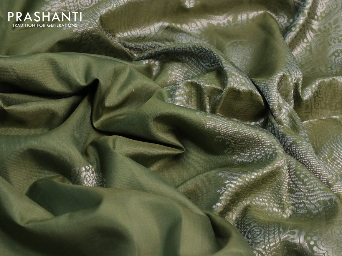 Pure soft silk saree green shade with silver zari woven buttas and rich silver zari woven border