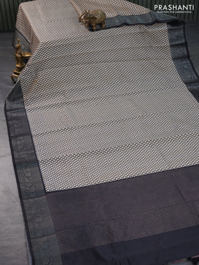 Semi tussar saree off white and black with allover prints and zari woven border