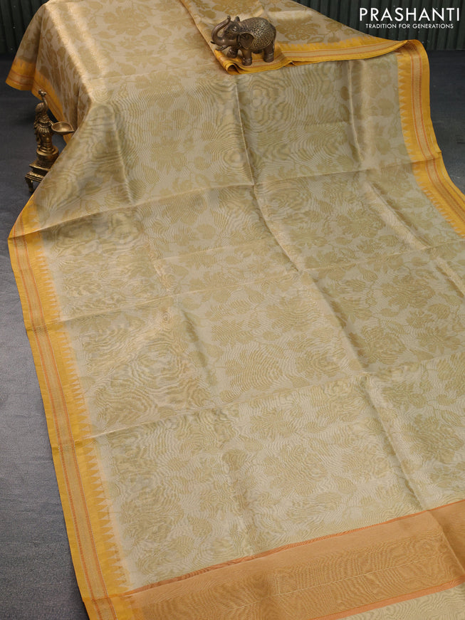 Tissue saree beige and mustard yellow with allover floral digital prints and temple design zari woven border