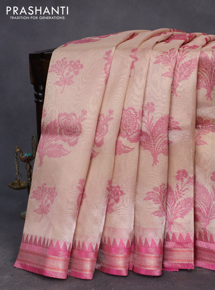 Tissue saree peach shade and pink with allover floral digital prints and temple design zari woven border