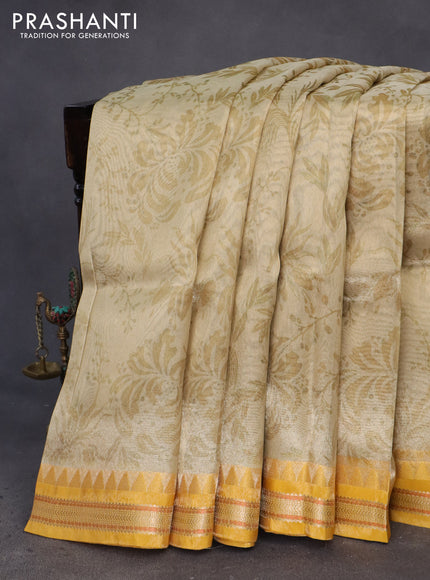 Tissue saree beige and mustard yellow with allover digital prints and temple design zari woven border