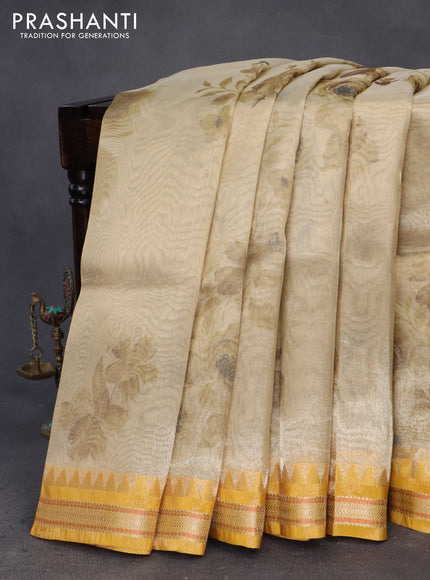 Tissue saree sandal and mustard yellow with allover floral digital prints and temple design zari woven border