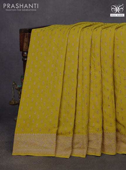 Banarasi crepe saree mustard shade with allover thread & zari woven buttas and woven border