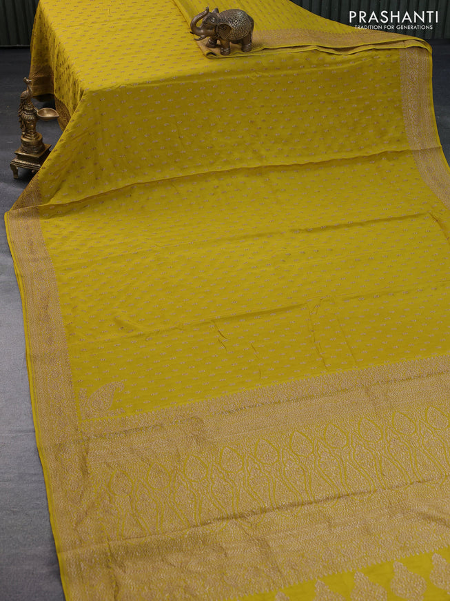 Banarasi crepe saree mustard shade with allover thread & zari woven buttas and woven border