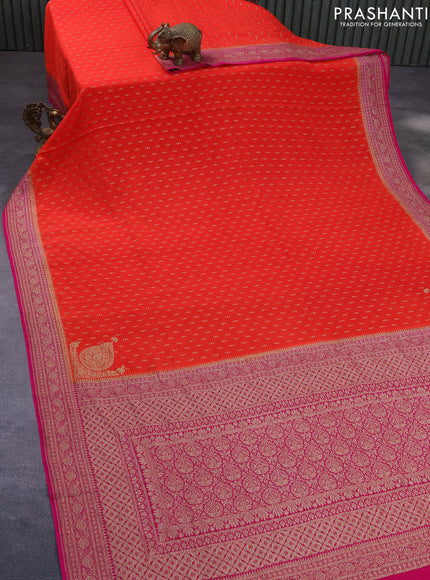 Banarasi crepe saree orange and pink with allover thread & zari woven buttas and woven border