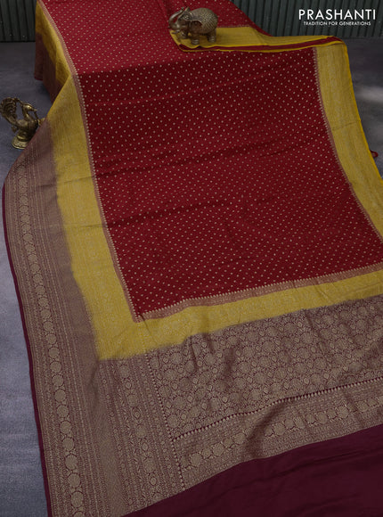 Banarasi crepe saree kukkum red and yellow wine shade with allover thread & zari woven buttas and long woven border