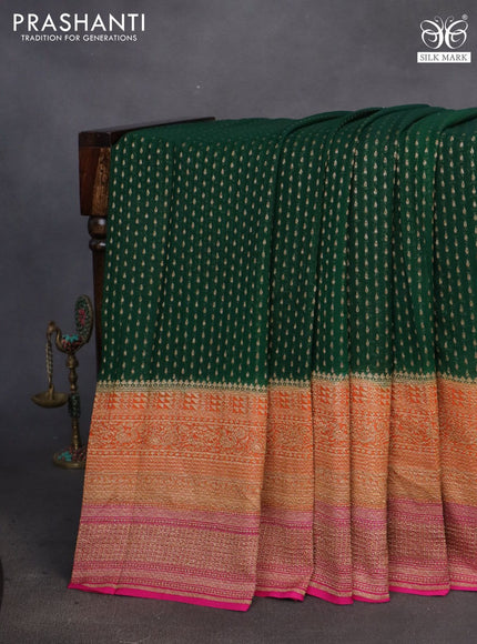 Banarasi georgette saree dark green and orange pink with allover thread & zari butta weaves and long woven border