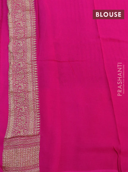 Banarasi georgette saree dark green and orange pink with allover thread & zari butta weaves and long woven border