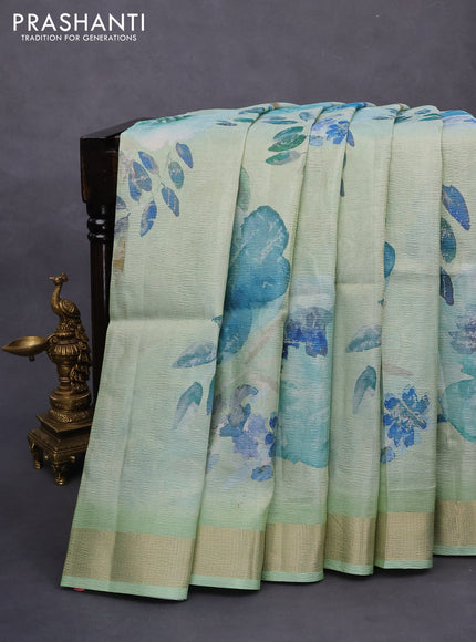 Crushed tissue saree pastel green with allover floral digital prints and zari woven border