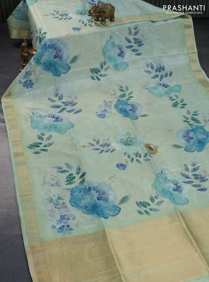 Crushed tissue saree pastel green with allover floral digital prints and zari woven border