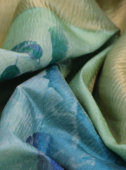 Crushed tissue saree pastel green with allover floral digital prints and zari woven border