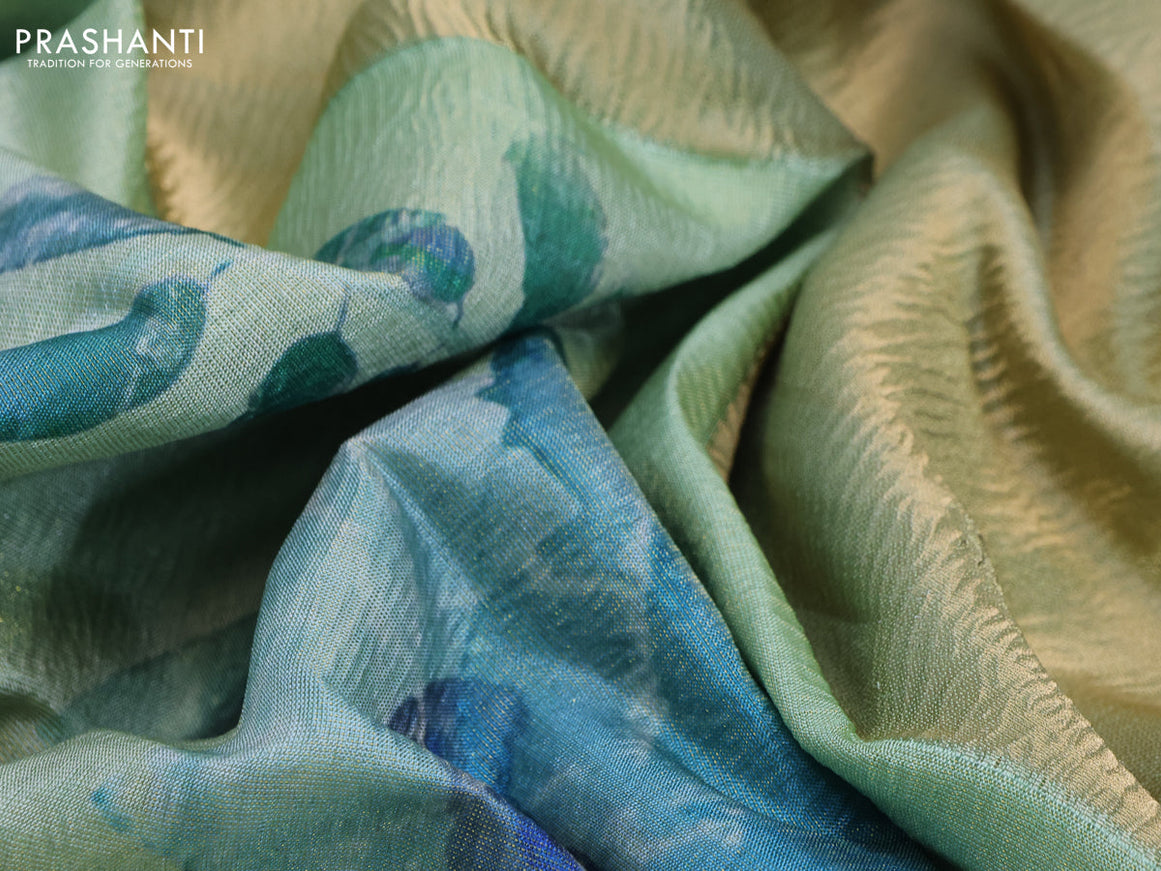 Crushed tissue saree pastel green with allover floral digital prints and zari woven border