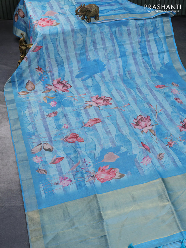 Crushed tissue saree light blue with allover floral digital prints and zari woven border