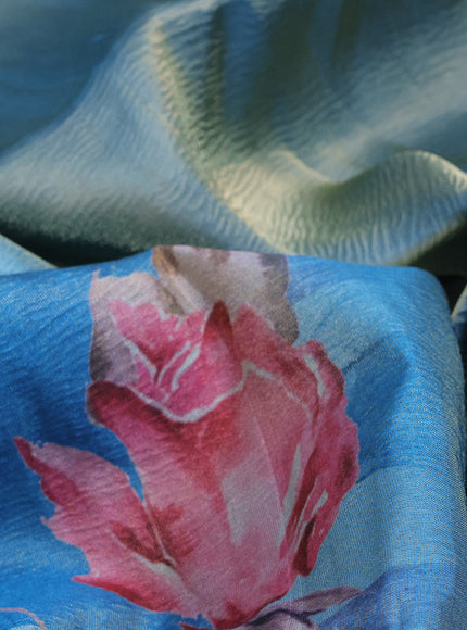 Crushed tissue saree light blue with allover floral digital prints and zari woven border