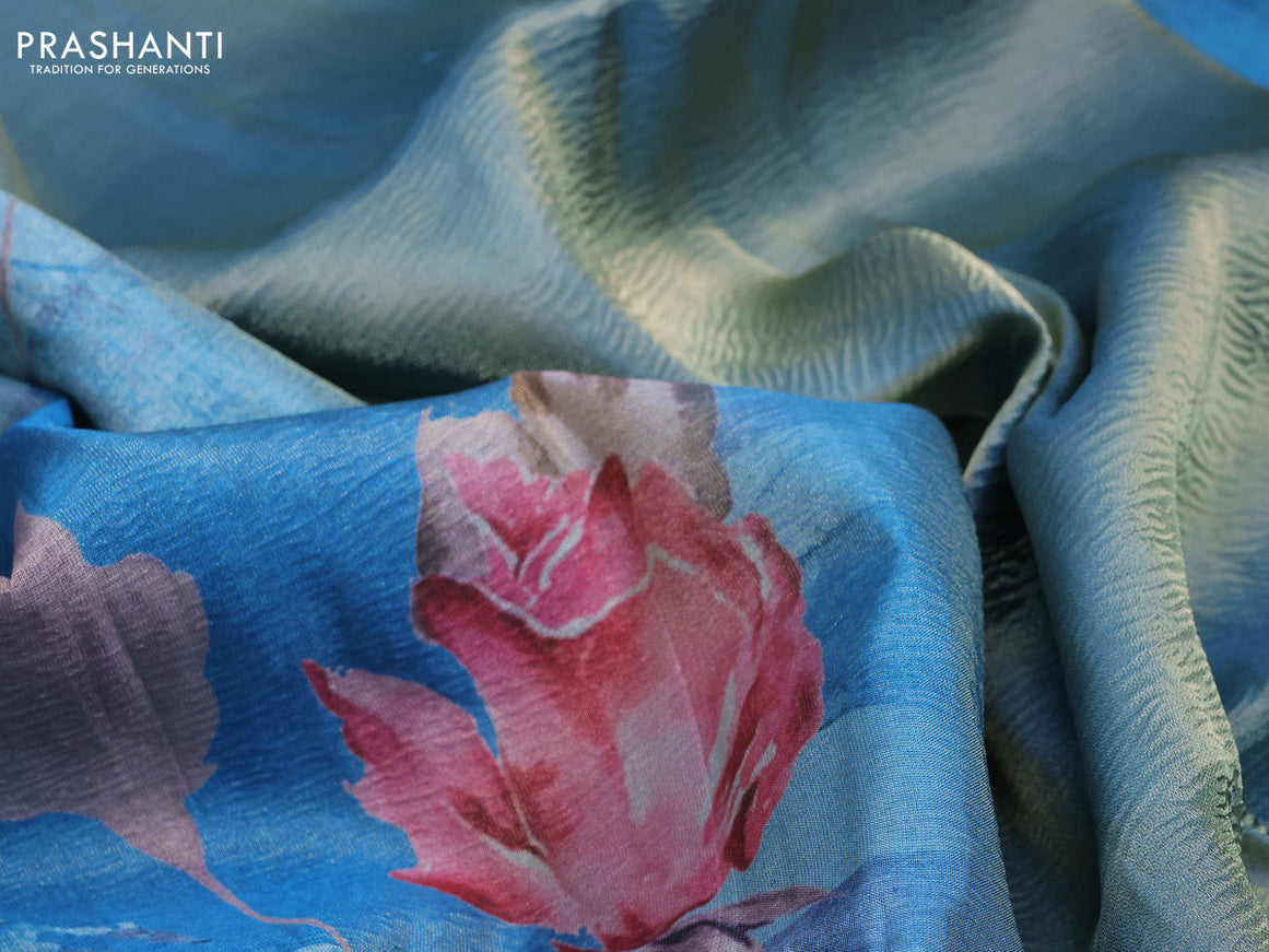 Crushed tissue saree light blue with allover floral digital prints and zari woven border