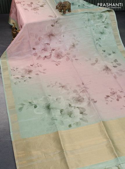 Crushed tissue saree pastel green with allover floral digital prints and zari woven border