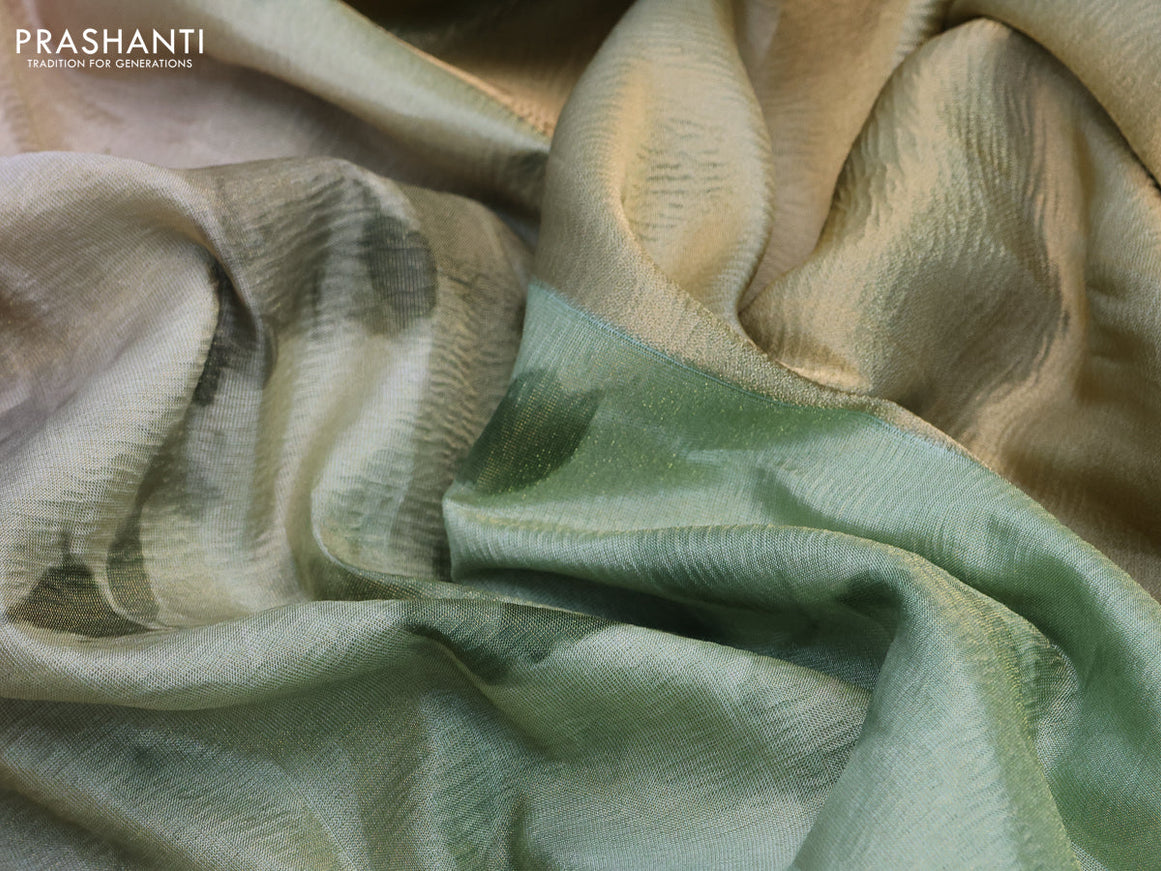 Crushed tissue saree pastel green with allover floral digital prints and zari woven border