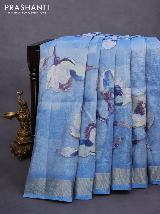 Crushed tissue saree light blue with allover floral digital prints and zari woven border