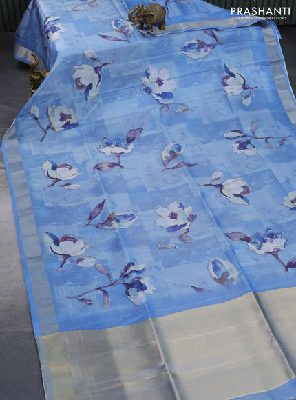 Crushed tissue saree light blue with allover floral digital prints and zari woven border