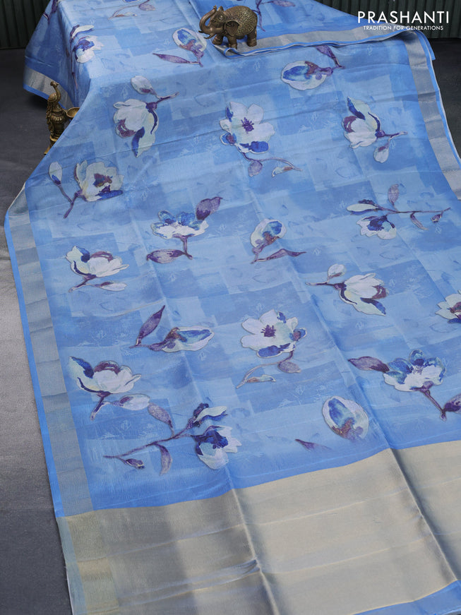 Crushed tissue saree light blue with allover floral digital prints and zari woven border