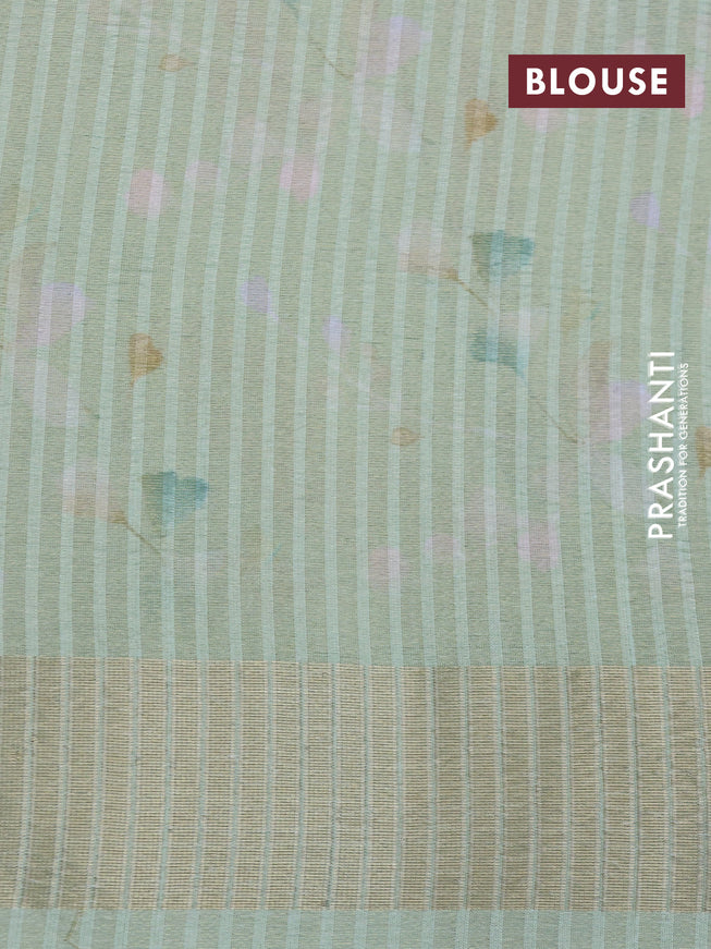 Crushed tissue saree pastel green with allover digital prints and zari woven border