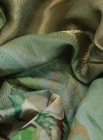 Crushed tissue saree pastel green with allover digital prints and zari woven border