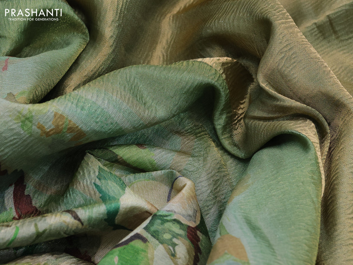 Crushed tissue saree pastel green with allover digital prints and zari woven border