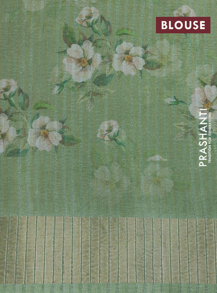 Crushed tissue saree pastel green with allover digital prints and zari woven border