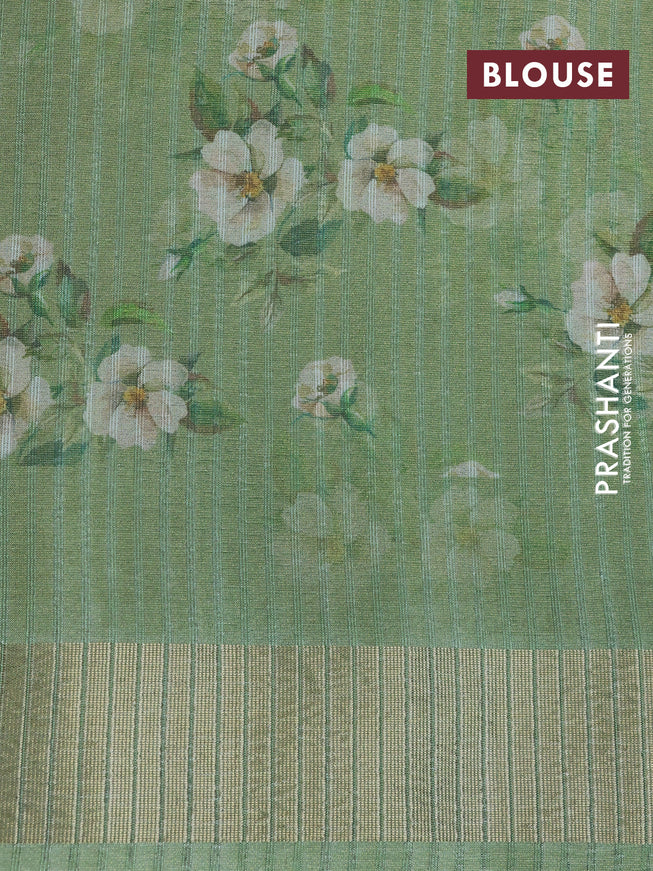 Crushed tissue saree pastel green with allover digital prints and zari woven border