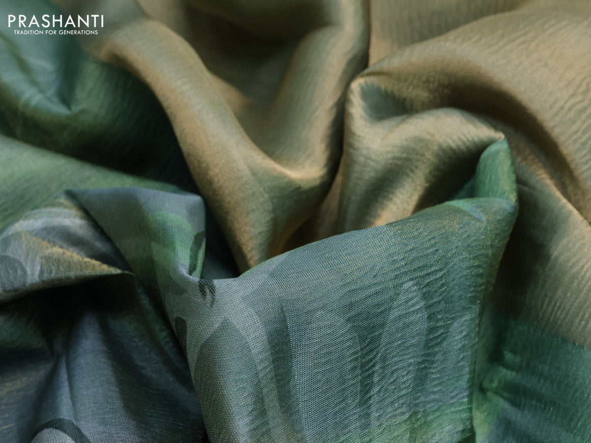 Crushed tissue saree pastel green with allover digital prints and zari woven border