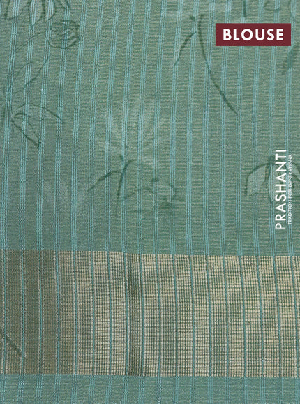 Crushed tissue saree pastel green with allover digital prints and zari woven border