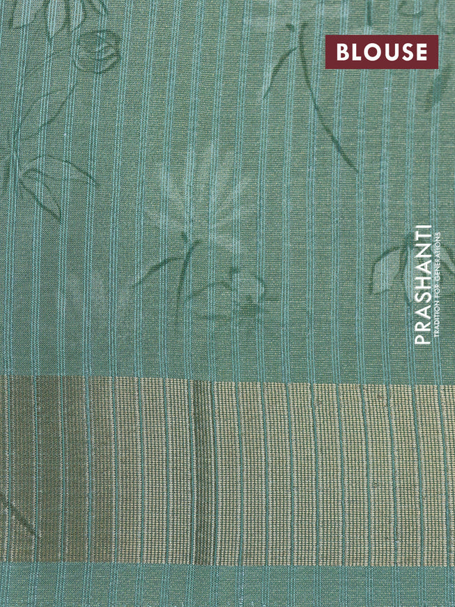 Crushed tissue saree pastel green with allover digital prints and zari woven border