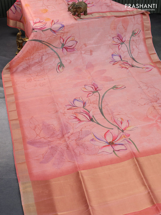 Crushed tissue saree peach shade with allover digital prints and zari woven border