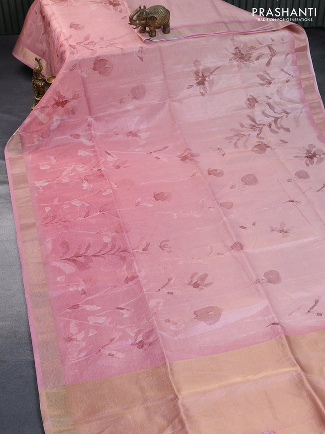 Crushed tissue saree mild peach pink with allover digital prints and zari woven border