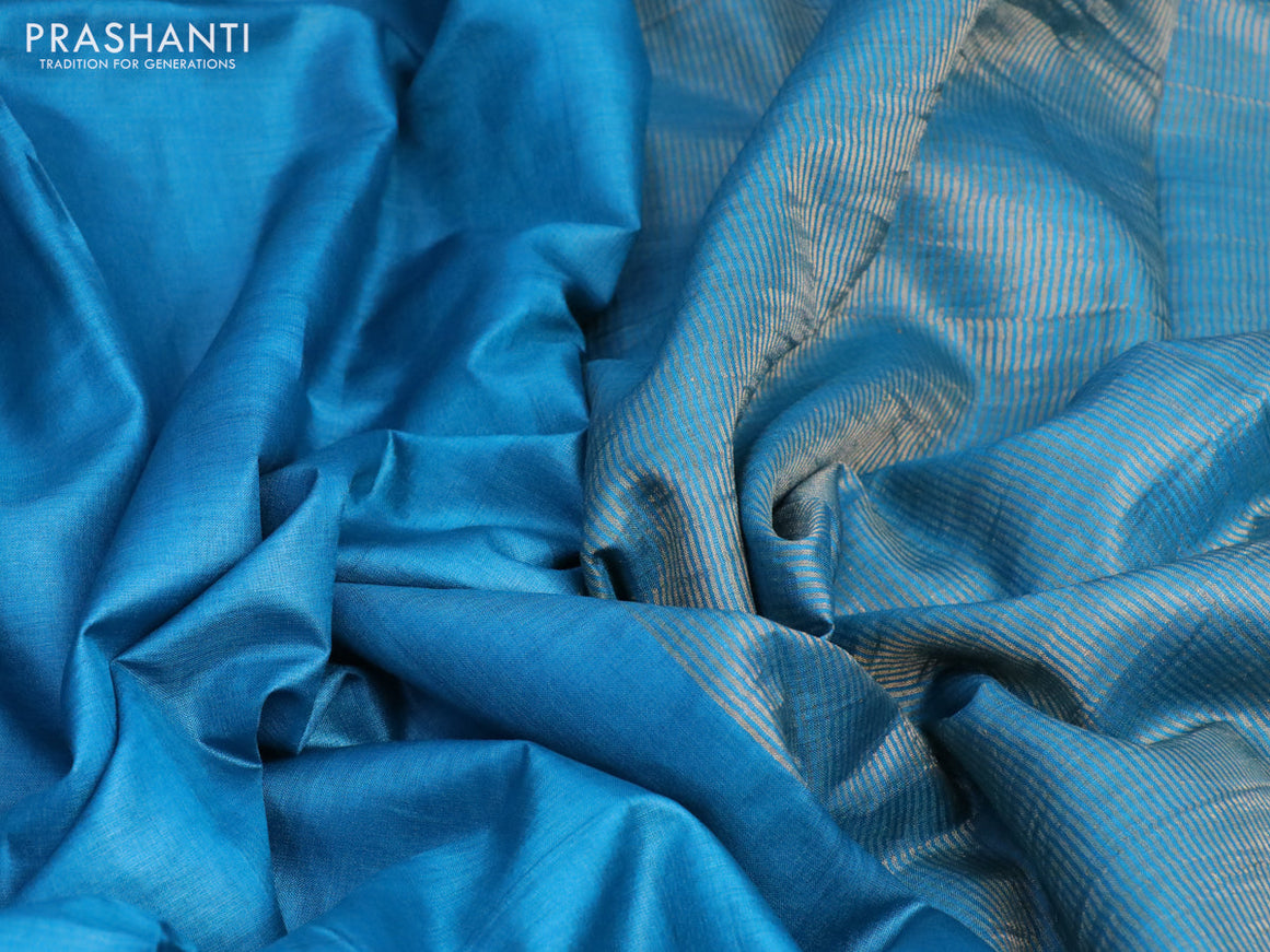 Pure tussar silk saree cs blue and orange with plain body and small zari woven border