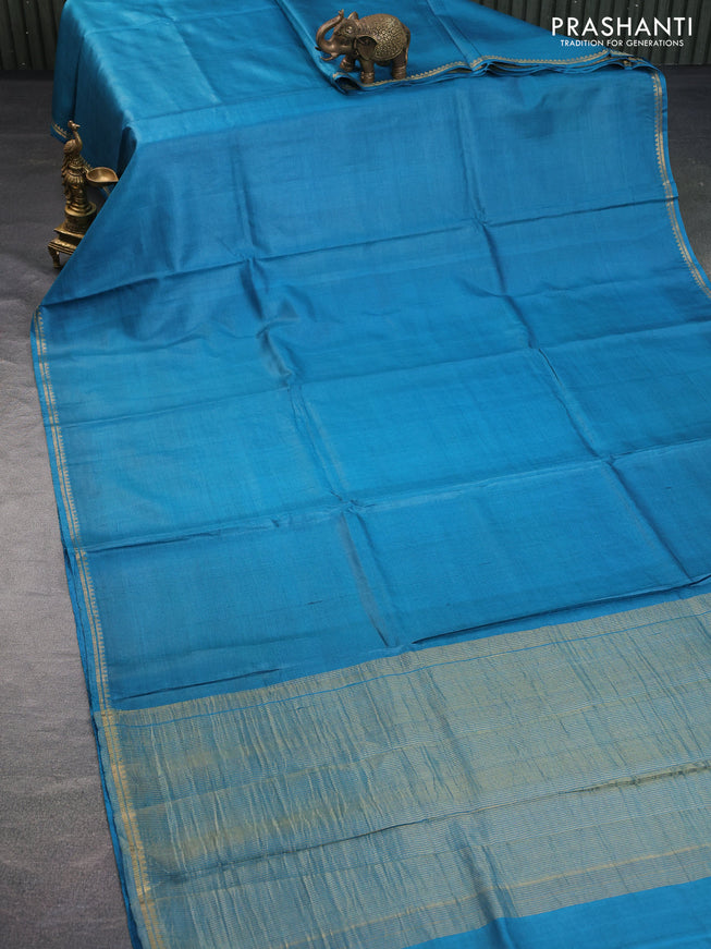 Pure tussar silk saree cs blue and peach shade with plain body and small zari woven border