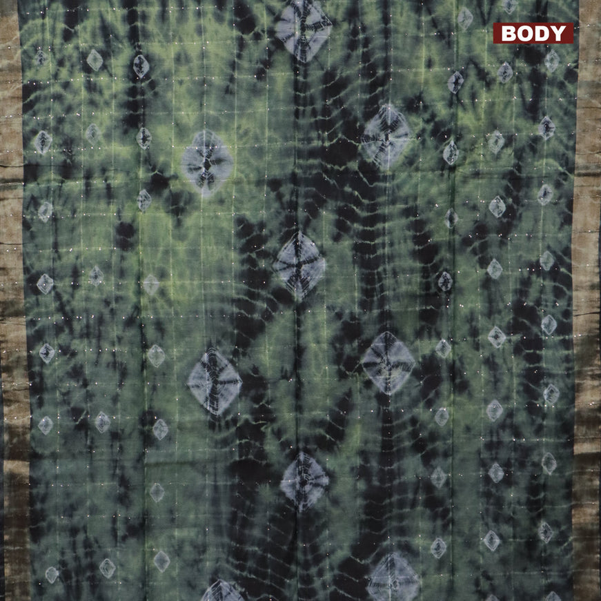 Bamboo saree green shade and black with allover sequin work & batik prints and zari woven border